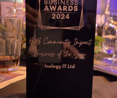 Inology IT team holding the Tameside Business Awards trophy for B2B Community Impact Business Of The Year 2024